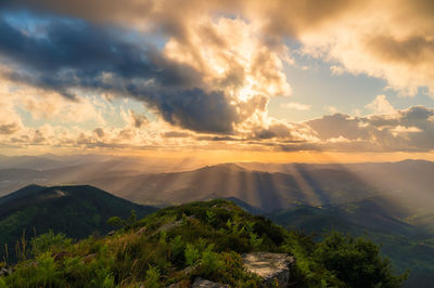 Scenic view of landscape against sky during sunset