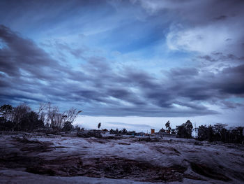 Scenic view of land against sky during winter