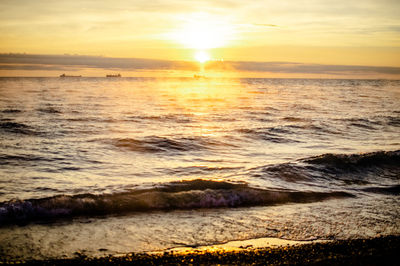 Scenic view of sea against sky during sunset