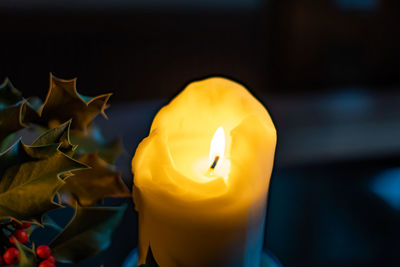 Close-up of yellow burning candle