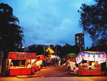 View of market in city at night