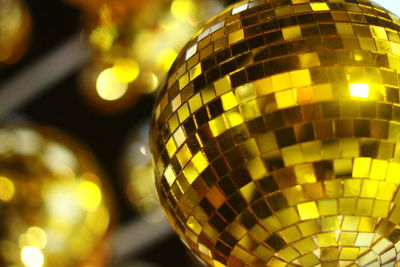   gold theme mirrir ball with bokeh blur background