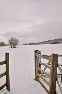 Scenic view of landscape against sky during winter