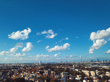 High angle view of townscape against blue sky