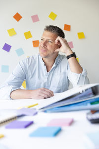 Portrait of businessman working at office