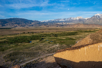 Owens river valley  below rock cliff snowy peaks eastern sierra nevada mountains california usa