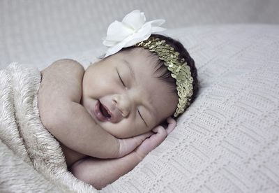 Close-up of cute sleeping newborn baby girl