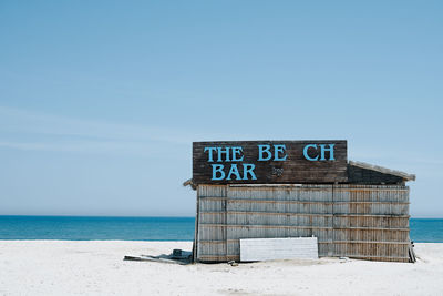 Bar at beach against clear sky