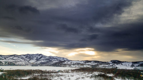 Scenic view of snowcapped mountains against sky