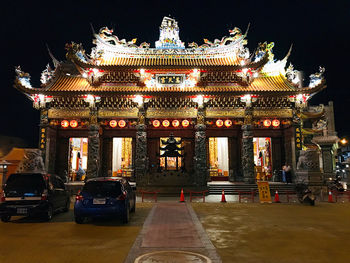 Illuminated building in city at night