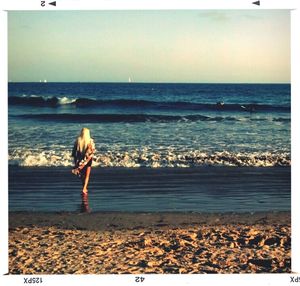 Woman standing on beach