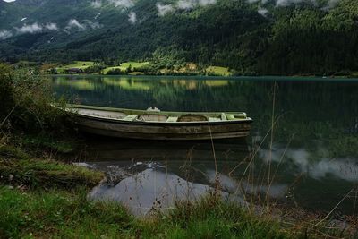 Boat moored at lake