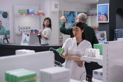 Smiling female doctor working in laboratory