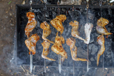 Close-up of meat on barbecue grill