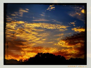 Low angle view of cloudy sky at sunset