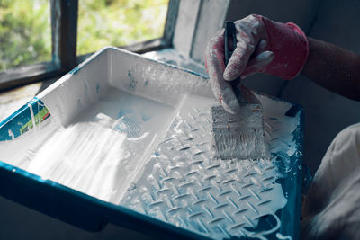 Close-up of hands working on cutting board