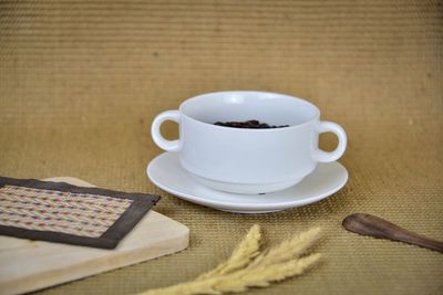 Close-up of coffee cup on table