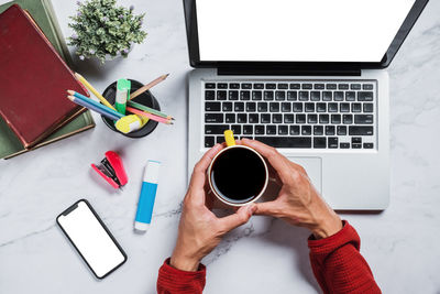High angle view of coffee cup on table