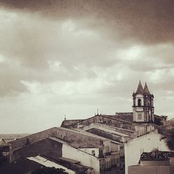 Clock tower against sky in city