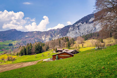 Scenic view of landscape and mountains against sky