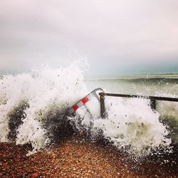 Close-up of water on sea against sky