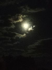 Low angle view of moon in sky at night