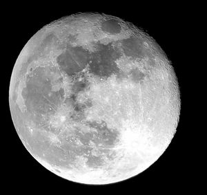 Low angle view of moon against sky at night