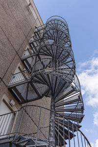 Low angle view of amusement park against sky