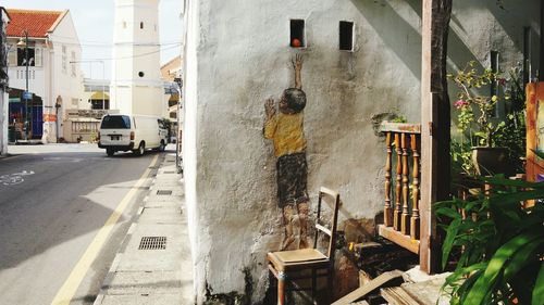 Rear view of man on street in city