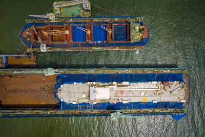 Aerial view of a shipyard repairing a large ship in thailand.