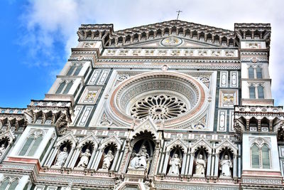 Low angle view of ornate building against sky