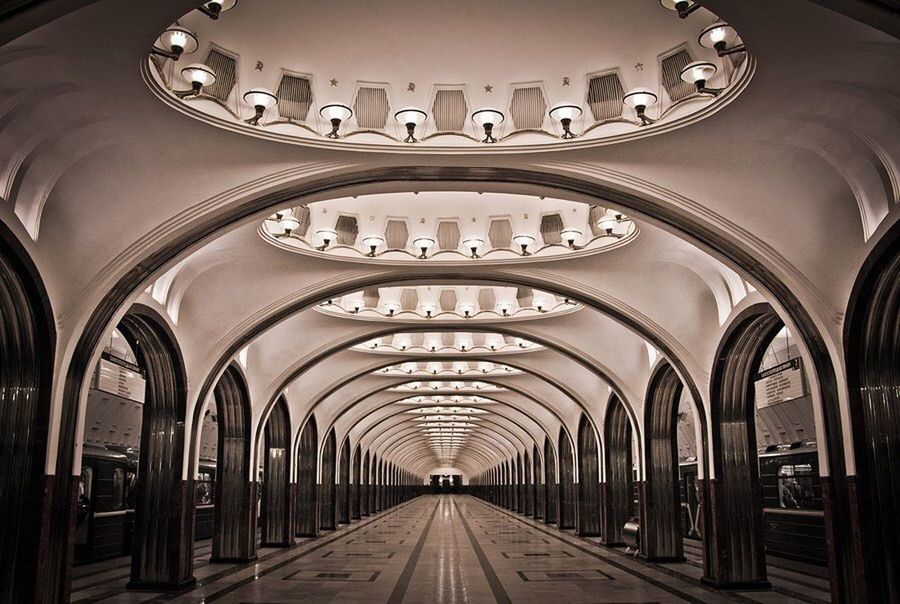 indoors, arch, ceiling, the way forward, architecture, diminishing perspective, built structure, interior, in a row, illuminated, empty, lighting equipment, transportation, vanishing point, corridor, absence, tunnel, incidental people, architectural column, no people