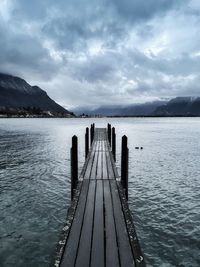 Pier over lake against sky