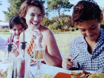 Portrait of a smiling girl sitting on table