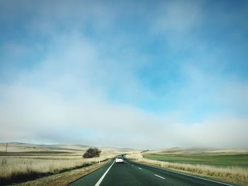 Road passing through field