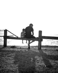 Woman standing on pier