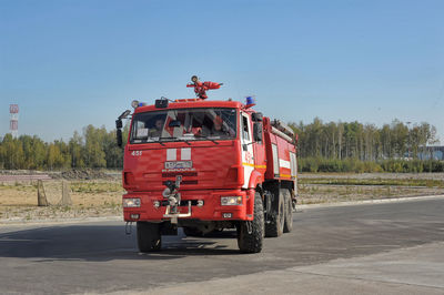 Vintage car on road against clear sky