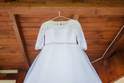 Clothes hanging on white ceiling