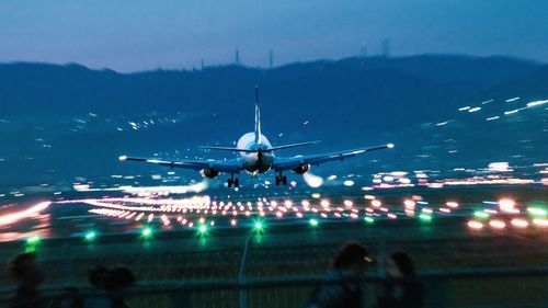 Airplane flying in sky at night