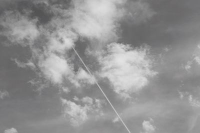 Low angle view of vapor trails in sky