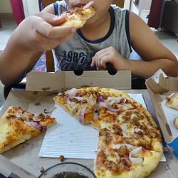 Midsection of man eating food