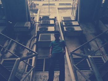 High angle view of man standing on stairs