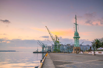 View of commercial dock against cloudy sky