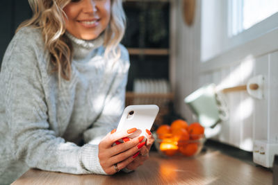 Young woman using phone