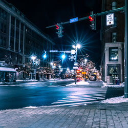 Illuminated buildings in city at night