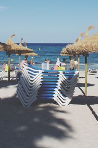 View of beach against clear blue sky