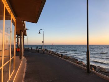 Scenic view of sea against clear sky during sunset