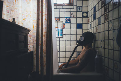 Woman sitting in window