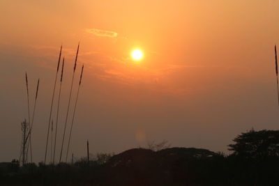 Silhouette landscape against sky during sunset