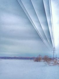 Scenic view of snow covered landscape against sky